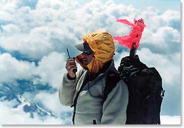 Wally standing with the orange wands which are used in whiteout conditions