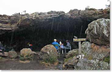 Guests enjoy their meals inside the beautiful caves at Kielewa Cave Camp, 11,811ft.