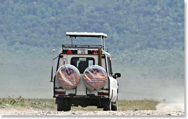 One of our BAI safari jeeps heads off into the Serengeti