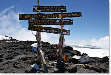 The summit sign on top of Uhuru Peak. Uhuru Peak is the highest point in Africa and one of the Seven Summits