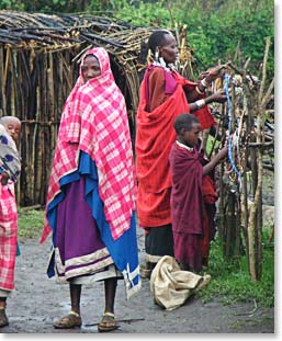 A group of Maasai women set out their colourful jewelry to be sold at markets