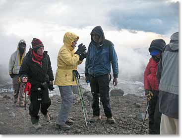 Teams stops for a water break, keeping hydrated is important for acclimatizing