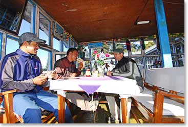 Jerome enjoys a laugh and breakfast with BAI guide Min and porter Shanda