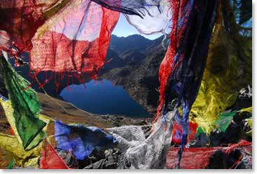 Colorful prayer flags adorn the views from Gosain Kunda