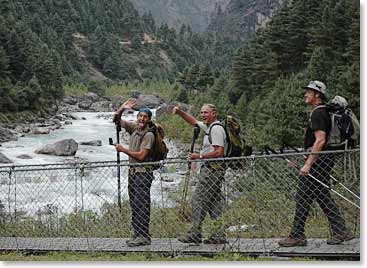 The team crosses the Dudh Kosi River on one of the many suspension bridges that are along this trek