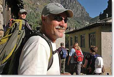 George soaks in the hot sun as he watches the hussle and bussle in Namche