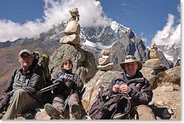 George, Sharon and Mitchell take a well deserved break in front of cairns that mark the trail