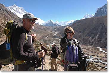 Sharon with George as they look over the ridge to the village of Pangboche