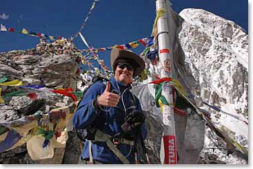 Rick triumphant amidst the banners and prayer flags on the top of Kala Patar!