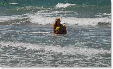 Enjoying fresh coconut juice while taking a refreshing dip in the ocean