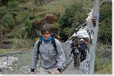 Michael leads the team across a suspension bridge