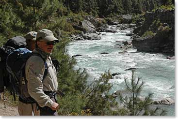 Leland takes a moment to look at the roaring Dudh Kosi River