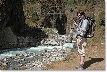 Michael points at the suspension bridge which he will cross on his way to Namche Hill