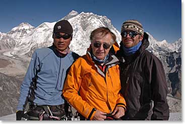 BAI climbing guide, Pemba Dorje stands with Leland and Michael