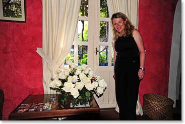 Line enjoys the fresh flowers in her room at the Hacienda Cusin