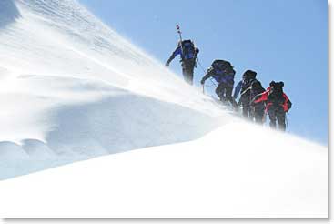 Now in the light of day, the team steadily climbs up the steep slopes of Cayambe