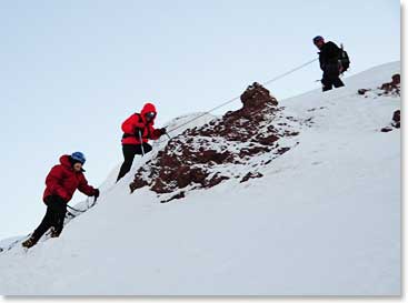 Oswaldo has Leila and Line on the rope as they climb high on Chimborazo