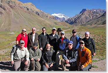 Team gets together for a photo with Aconcagua towering in the background