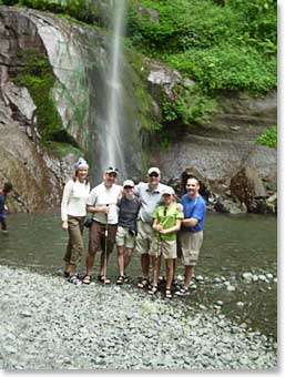 Our team gets together for a photo at the waterfall