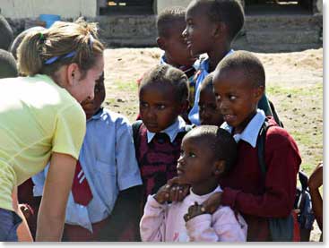 Julia, our youngest climbing member, takes an opportunity to talk with the children