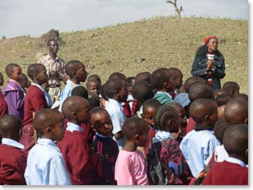 Children from the Linde School greet our team with songs and excitement