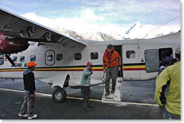 Jim steps off the plane into the cool mountain air at Lukla early in the morning