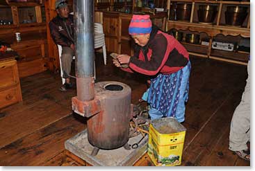 Stoking the fire in one of our comfortable lodges