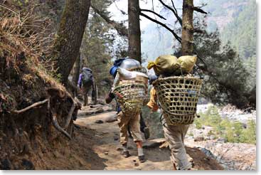 A common sight is porters carrying loads to Namche Market