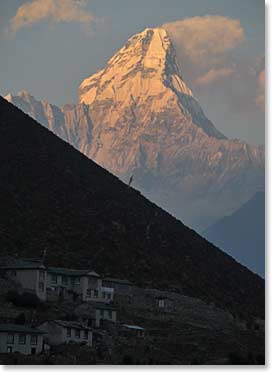 Ama Dablam stands magnificently as the sun sets in Khumjung