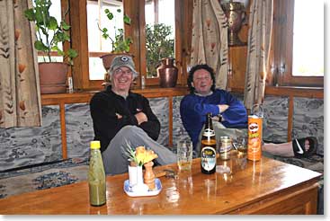Now we are at Paradise Lodge with the airstrip behind us; Time for David and Rob to enjoy an Everest Beer and some Pringles