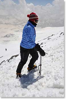 Carol's first steps using crampons and an ice axe