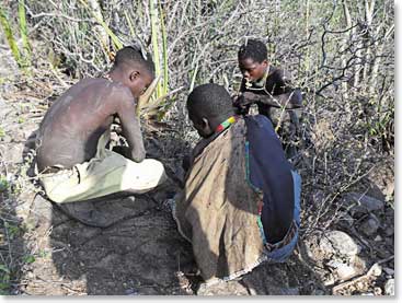 Three local boys keeping themselves busy