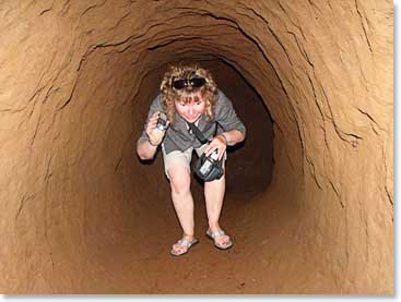 The caves can be quiet small, Marjorie makes her way through