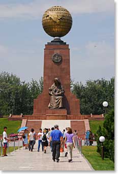 Mike and Kathy stroll toward Independence Monument.  Made from the melted bronze of a Lenin statue, this globe represents Uzbekistan’s independence