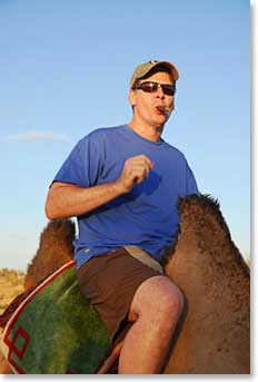 Mike enjoyed a cigar astride his two-humped camel.