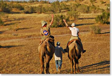 Riding into the sunset.  Paul and Nancy Lee wave as they take off across the desert.