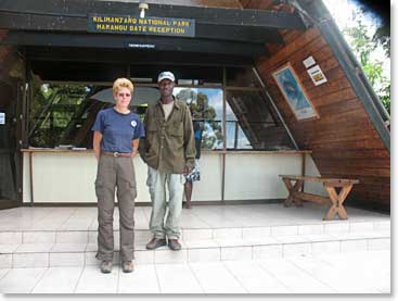 Julius and Chris obtaining the permit at Marangu Gate