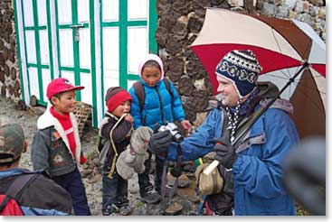 When we arrived in Khumjung, the Hillary school had just let out for the day.  Jeff and some of the kids enjoyed photos from his digital camera.