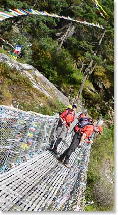 Mike is checking the view of the Doshi River from high on the bridge