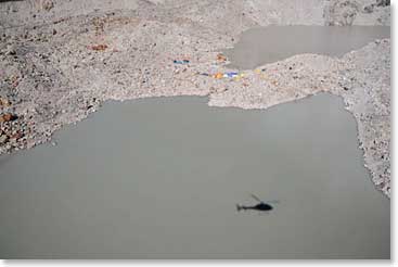 Soon they were flying high over Pumori Base Camp, seeing their reflection in the lake below