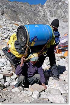 Porters preparing heavy loads for transport back down our trekking route