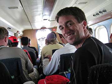 Charles is happy to be on the plane on his way to Lukla