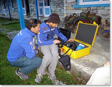 Jamie and Scott are working on the computers in praperation for being online during the expedition