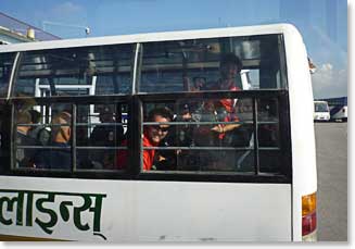 Jamie with the climbing team waiting inside the bus to board the plane to Lukla – quite a long wait…