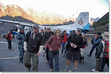 The group makes their way off of the plane