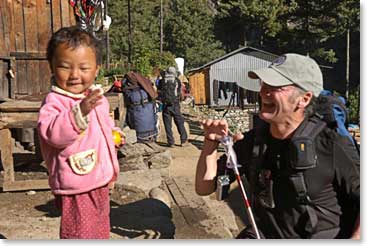 Reginald stops to play with a toddler along the way