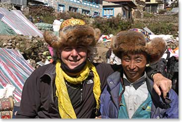 George purchasing a unique hat from a local