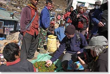 Some of the group checks out the local produce for sale