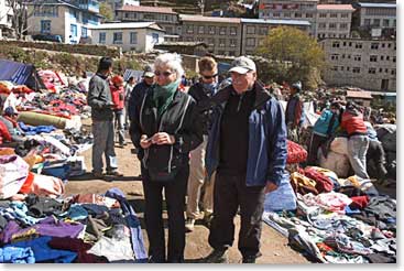 Sharon and Richard stroll through the clothing for sale