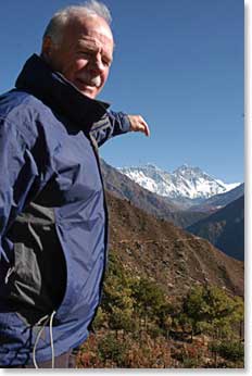 George points to the summit of Everest with his finger